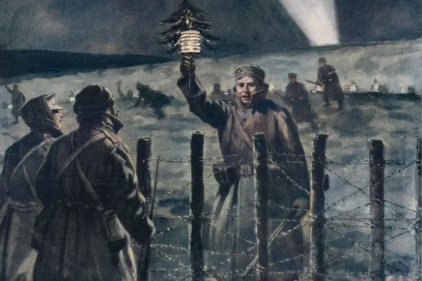 En soldat vid skyttegravarna som håller upp en lykta och en liten gran.